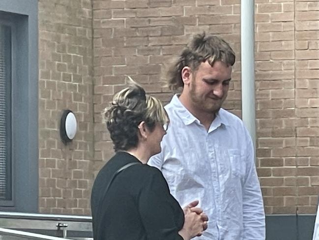 Hancock (white shirt) outside Wyong Local Court where he pleaded guilty yo three offences. Picture: NewsLocal