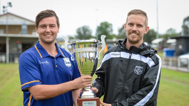 The Waves captain Callum Hillier with Bingera captain Daniel Watson with the Triple M Cup in 2019.