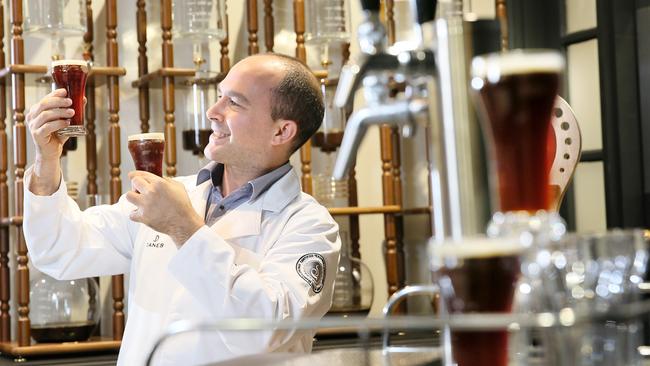 Head trainer Jon Saroglu with the nitrogen-infused cold brew coffee. Picture: Troy Snook