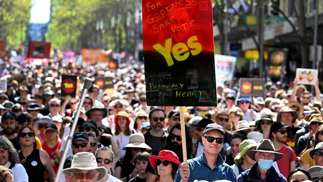 Crowds march during a "Walk for Yes" rally in Melbourne on September 17, 2023. Thousands joined "Walk for Yes" events in major cities, ahead of the referendum that could grant Indigenous Australians a constitutionally enshrined right to be consulted on policies that affect them -- a "Voice to Parliament". (Photo by William WEST / AFP)