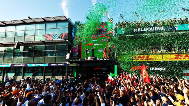 MELBOURNE, AUSTRALIA - APRIL 10: Race winner Charles Leclerc of Monaco and Ferrari, Second placed Sergio Perez of Mexico and Oracle Red Bull Racing and Third placed George Russell of Great Britain and Mercedes celebrate on the podium during the F1 Grand Prix of Australia at Melbourne Grand Prix Circuit on April 10, 2022 in Melbourne, Australia. (Photo by Mark Thompson/Getty Images)