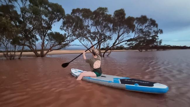 Kimba resident Mel Cliff in the floodwaters around her home after the record rainfalls . Picture: Mel Cliff