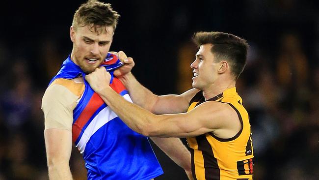 Jaeger O’Meara and Jordan Roughead go toe-to-toe at Etihad Stadium. Picture: Mark Stewart