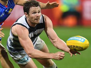 Patrick Dangerfield of the Cats (right) and Luke Dahlhaus of the Bulldogs contest during the Round 9 AFL match between the Geelong Cats and the Western Bulldogs at Simonds Stadium in Geelong, Friday, May 19, 2017. (AAP Image/Julian Smith) NO ARCHIVING, EDITORIAL USE ONLY