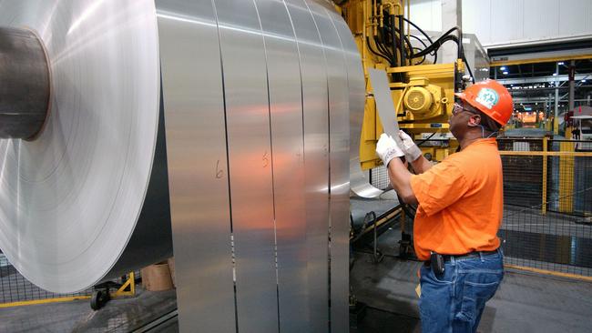 Producing rolls of aluminium.