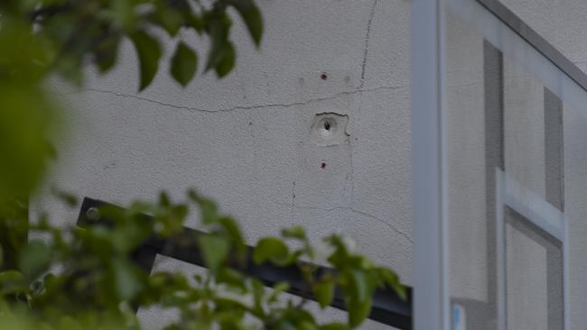 Bullet holes in the facade of the home: RoyVPhotography