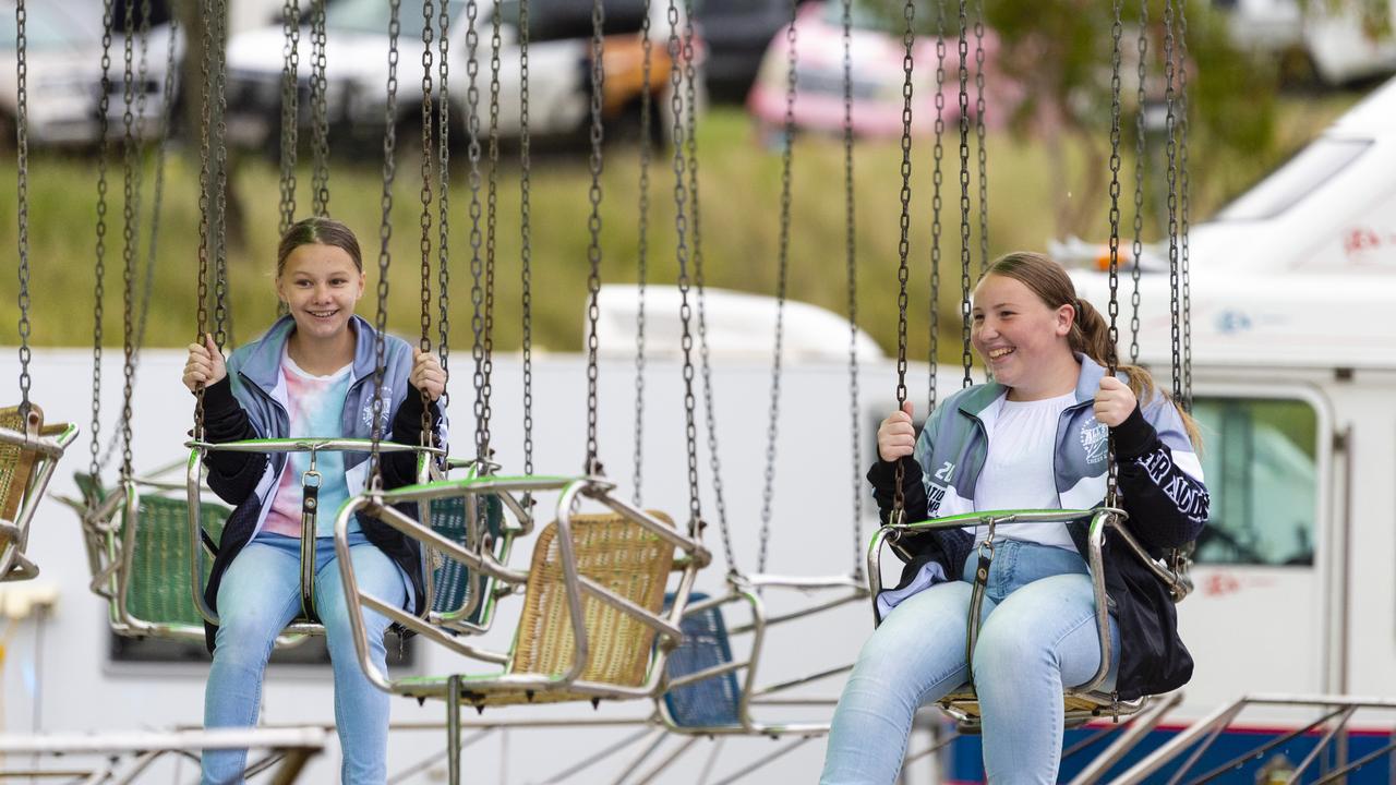 Olivia Sheward (left) and Isabella Horder get ready to ride at the 2022 Toowoomba Royal Show, Saturday, March 26, 2022. Picture: Kevin Farmer