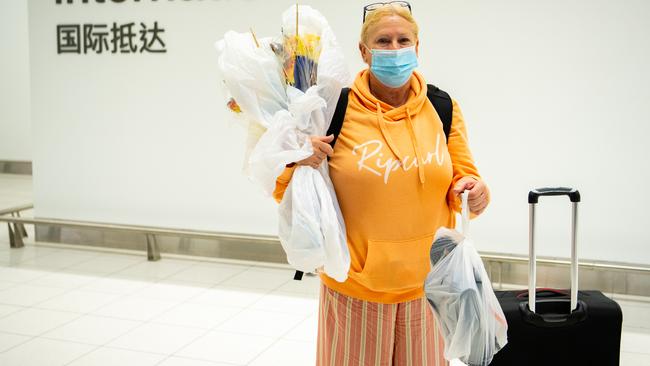 International traveller Sue Price exits customs at Adelaide Airport after arriving from Denpasar, Bali. Picture: Morgan Sette