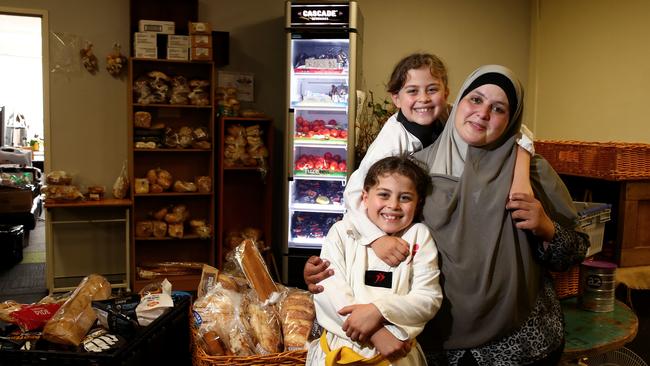 Mona Mahamed – pictured with daughters Hoda and Nada – founded Community Support Services in Bankstown and supports the idea. Picture: Toby Zerna