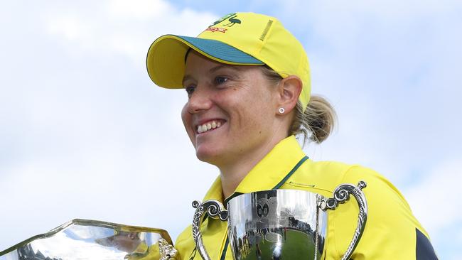 WELLINGTON, NEW ZEALAND - DECEMBER 23: Alyssa Healy of Australia poses with the Rose Bowl and series trophy after winning game three of the Women's ODI series between New Zealand and Australia at Basin Reserve, on December 23, 2024, in Wellington, New Zealand. (Photo by Hagen Hopkins/Getty Images)