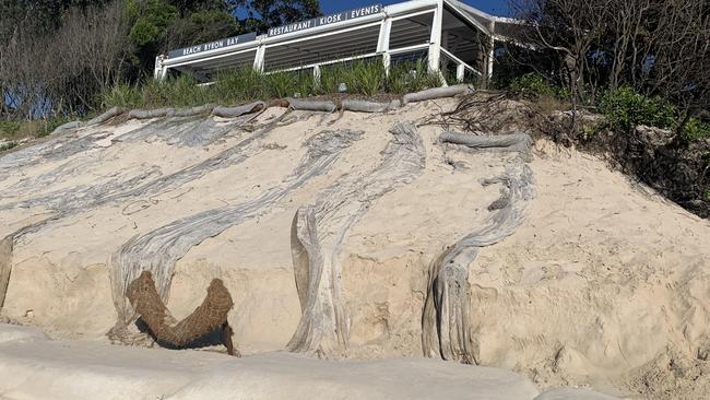 The view of Beach Byron Bay restaurant, reinforced by a sandbag wall on Clarkes Beach, pictured on June 7, 2021. Picture: Liana Boss