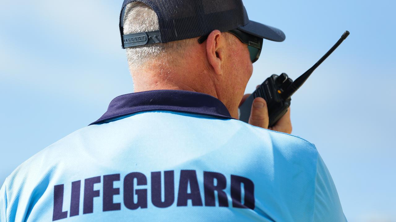 Peter Halcrow Head Lifeguard seen on the radio at Coogee Beach, in Sydney. Picture: NCA NewsWire / Gaye Gerard