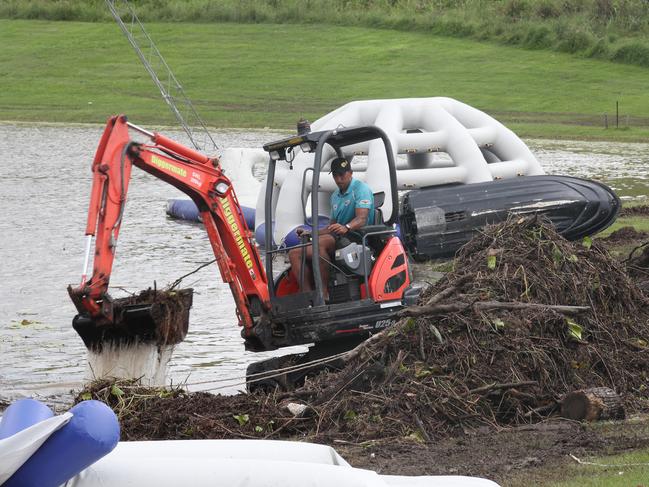 Gold Coast Wake Park in Oxenford has been completely smashed by the floods. Staff trying to clean the place so they can reopen on the weekend. Picture Glenn Hampson