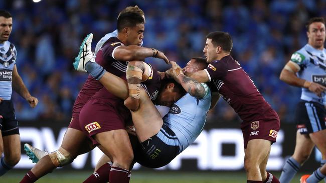 David Klemmer is snapped in half by the Maroons defence. Picture: Getty Images