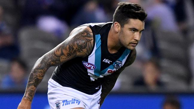 Port Adelaide midfielder-forward Chad Wingard feeling his hamstring — again — late in the Power’s win against North Melbourne at Etihad Stadium on Saturday. Hamstring injuries have become a major concern in the AFL this season. Picture: Joe Castro