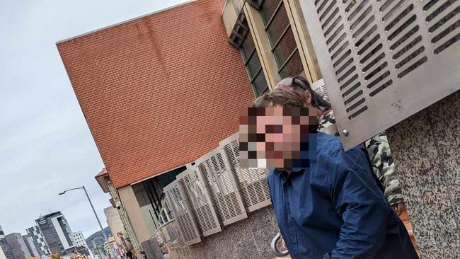 Bradley Graham Paul Cate leaves Hobart Magistrates Court. Cate is charged with grooming with intent to procure a child or young person for sexual abuse, indecent act with child or young person, and penetrative sexual abuse of a child of young person.