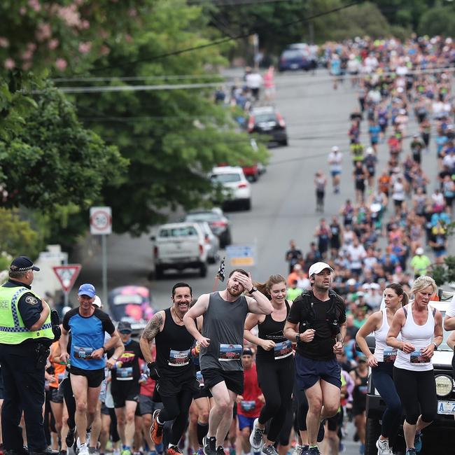 Runners at Huon Rd start the climb to the pinnacle in the 2018 Point to Pinnacle. Picture: LUKE BOWDEN