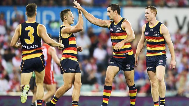 Crows players celebrate a goal in their impressive win at the SCG on Friday. Picture: Brett Hemmings/AFL Media/Getty Images