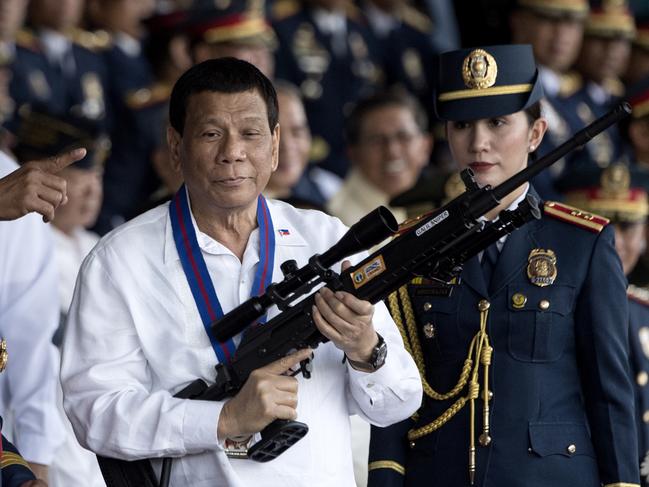 Philippine President Rodrigo Duterte holds a Galil sniper rifle at a ceremony in Manila in 2018. Picture: Noel Celis/AFP