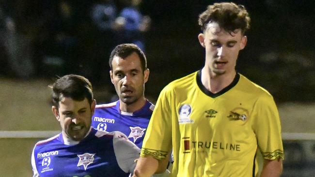 Adelaide-born Moreton Bay United Jackson Courtney-Perkins, in yellow, could be on his way to Raiders. Photo by Andrew Shaw/visiblefocus.com