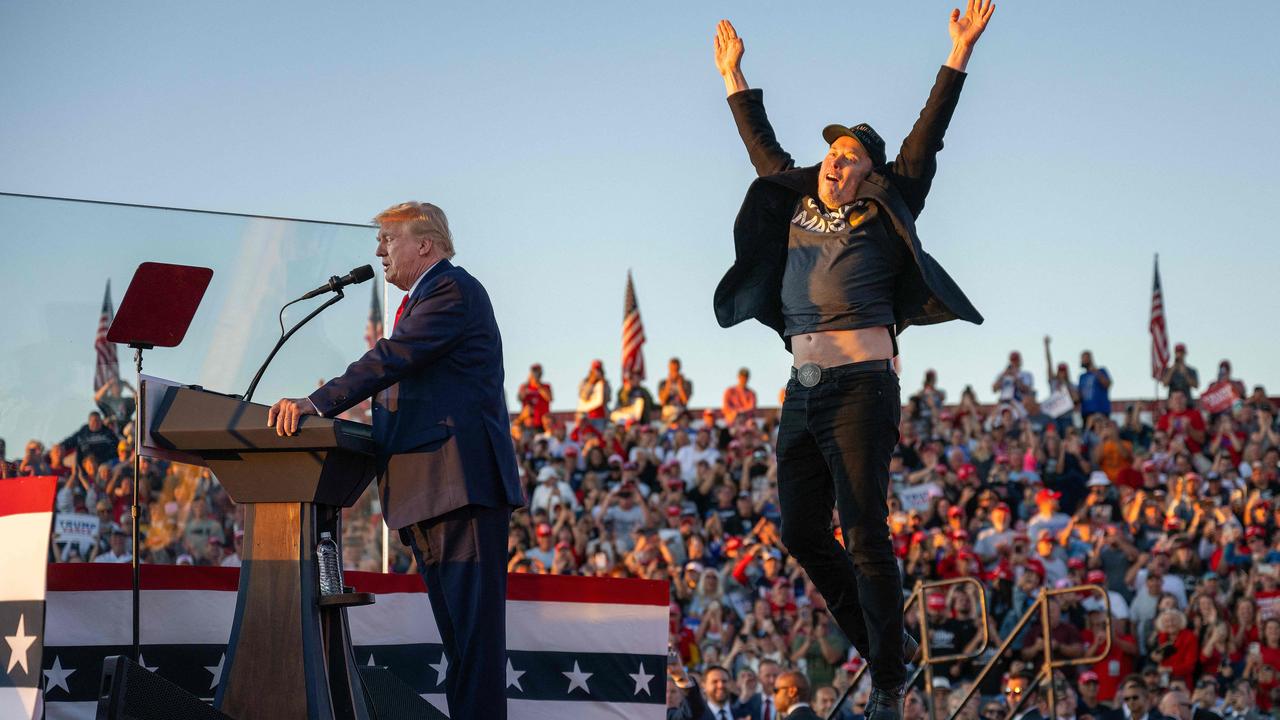 Musk, pictured here jumping behind Trump, also accompanied the President-elect during his campaign trail. Picture: Jim Watson / AFP