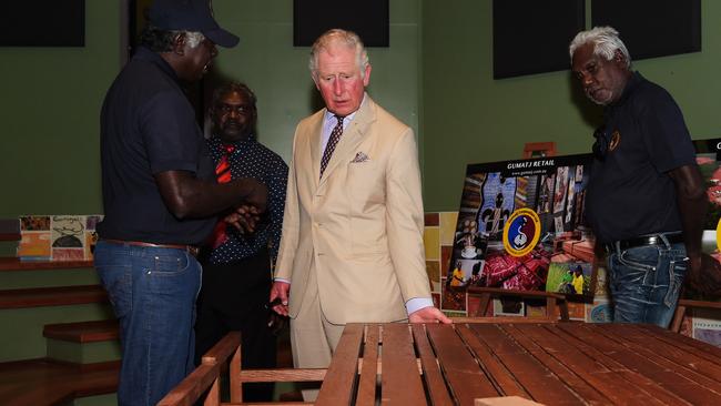 Gumatj Elders Djawa and Balupalu Yunupingu show Charles, Prince of Wales some of the furniture from their Gumatj workshop Picture: Keri Megelus