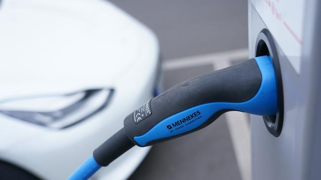 A Tesla electric car charges at a public charging station in Germany. Picture: Sean Gallup/Getty Images