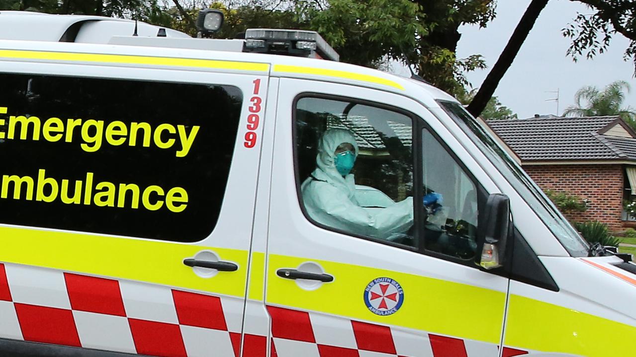 Pictured is an ambulance leaving Anglicare's Newmarch House nursing home at Caddens in western Sydney. Picture: Richard Dobson