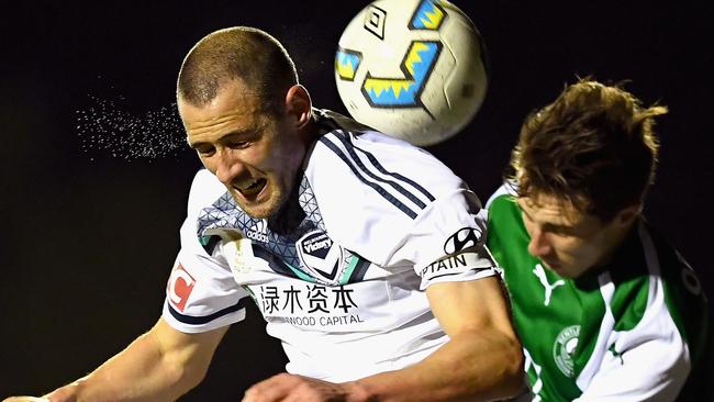 Melbourne Victory captain Carl Valeri in action against a Bentleigh Greens opponent in their FFA Cup quarter-final on Tuesday night.
