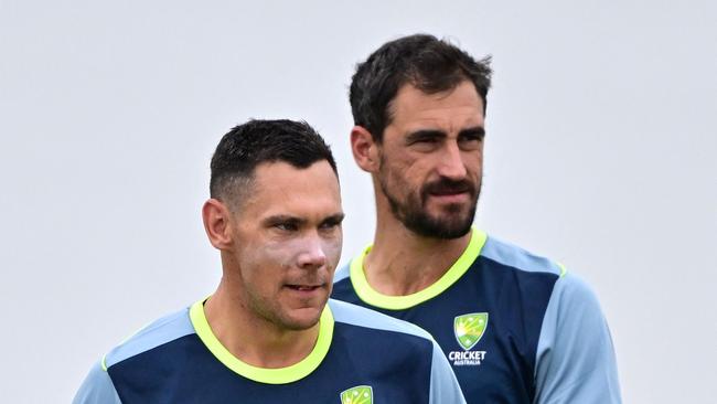 Mitchell Starc (R) is set to get the nod over Scott Boland (L) (Photo by Ishara S. KODIKARA / AFP)