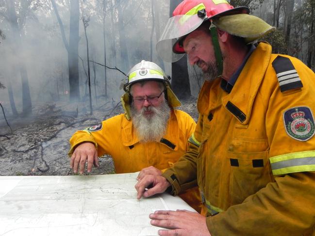 Lawrence RFS firefighter Darrell Binskin and Lawrence RFS captain Scott Campbell assess the bushfire in the Fortis Creek National Park north of Grafton on Friday, 28th October, 2016.Photo Bill North / Daily Examiner