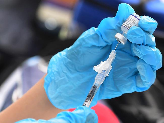 Dr Young has urged anyone not planning to get the jab to reconsider. Picture: Frederic J. Brown/AFP