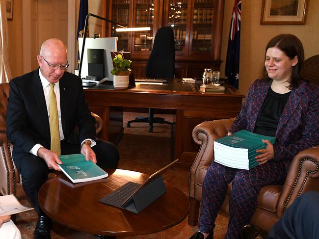 Governor General David Hurley recieves the final report of The Royal Commission into Aged Care Quality and Safety from Commisioner Lynelle Briggs (left) and Acting Official Secretary Sara Samios, with Commission Chair Tony Pagone joining via video link, at Admiralty House in Sydney, Friday, February 26, 2021. The aged care royal commission has delivered the final report to the federal government but it likely won't be made public until next week. (AAP Image/Dan Himbrechts) NO ARCHIVING