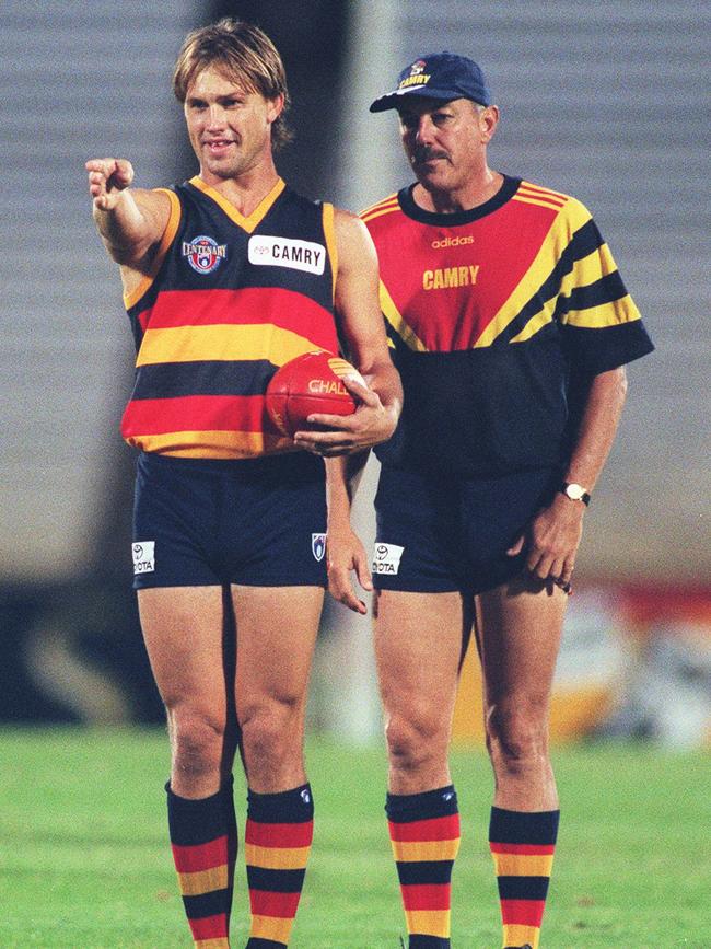 Crows star Tony Modra with football coach Malcolm Blight at training.