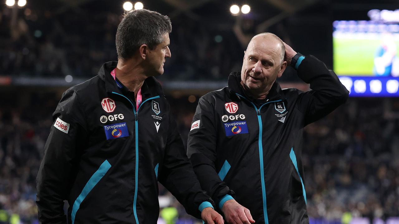 Port Adelaide coach Ken Hinkley, right, has asked the AFL about some of the umpiring decision from Saturday night. Picture: Mark Stewart