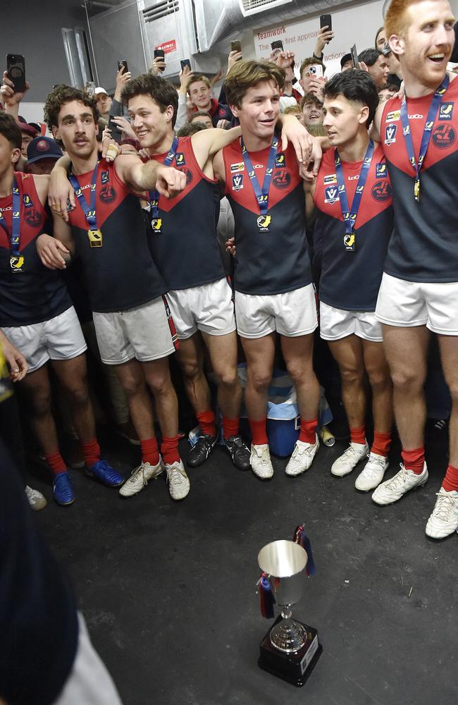 Mt Eliza celebrate in the rooms after their win. Picture: Andrew Batsch