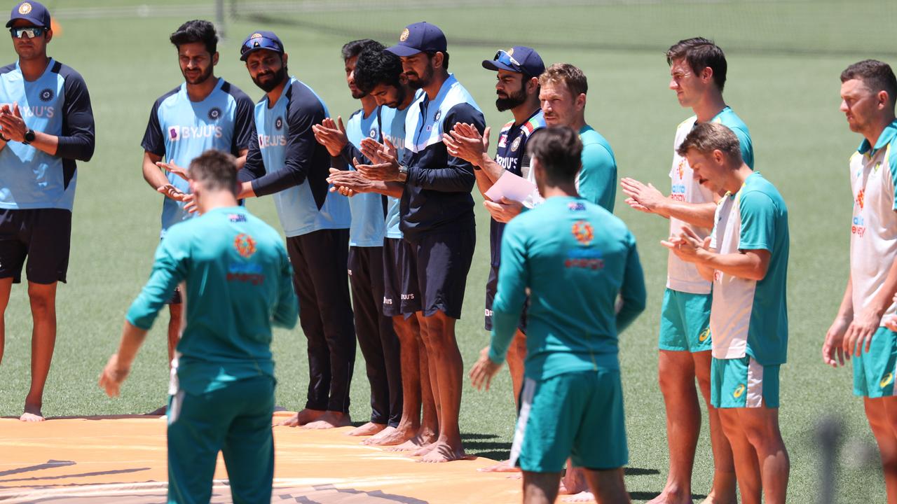 Australia and India take part in a barefoot ceremony in support of Black Lives Matter before the One-Day International cricket match between Australia and India at the SCG. Picture: Brett Costello