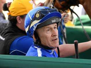 Jockey Jeff Lloyd unsaddles Savsgold after another win at the Ipswich Racetrack. Picture: Rob Williams