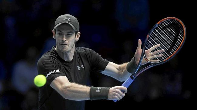 Britain's Andy Murray returns the ball against Milos Raonic of Canada at the ATP World Tour Finals at the O2 Arena in London. Picture: WILL OLIVER