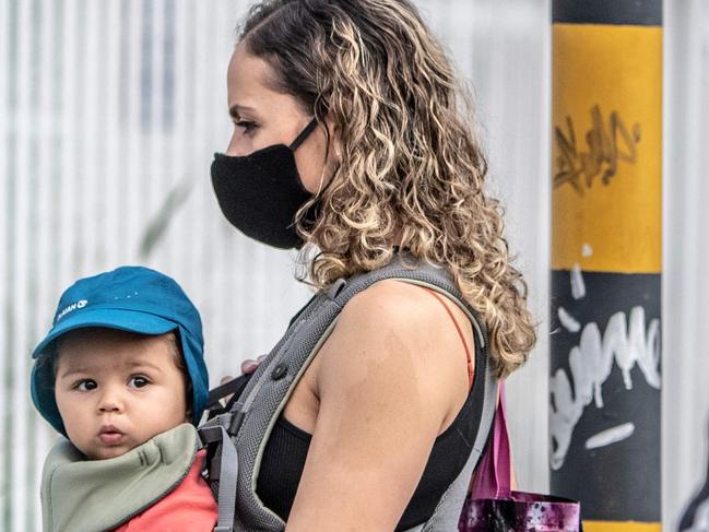 TOPSHOT - A woman wearing a face mask, as a preventive measure against the spread of the novel coronavirus, COVID-19, walks in the streets of Bogota on May 14, 2020. - Latin America and the Caribbean exceeded 400,000 confirmed cases of the new coronavirus on Thursday, which has already killed 244,405 people in the region, according to an AFP balance with official data. (Photo by Juan BARRETO / AFP)