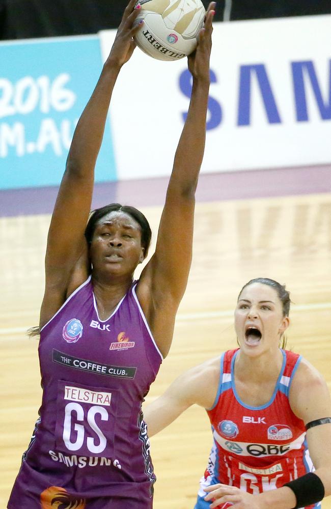 The Firebirds’ Romelda Aiken grabs the ball ahead of the Swifts’ Sharni Layton.