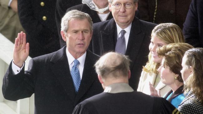 George W. Bush takes the oath of office as the 43rd president at the US Capitol in Washington, watched by his wife and daughters, on January 20 2001. Picture: AP