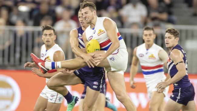 Marcus Bontempelli can’t get a kick away as he’s tackled by Nat Fyfe. Picture: AAP