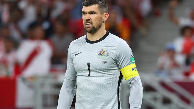 Australia's goalkeeper Mathew Ryan looks on during the FIFA World Cup 2022 inter-confederation play-offs match between Australia and Peru on June 13, 2022, at the Ahmed bin Ali Stadium in the Qatari city of Ar-Rayyan. (Photo by KARIM JAAFAR / AFP)