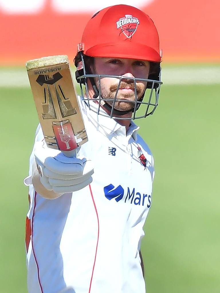 Travis Head celebrates a Sheffield Shield ton.