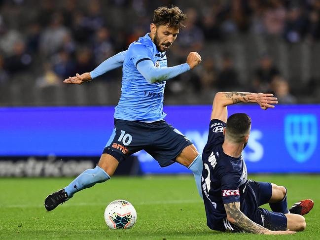 Milos Ninkovic scores a late first-half goal against Melbourne Victory.