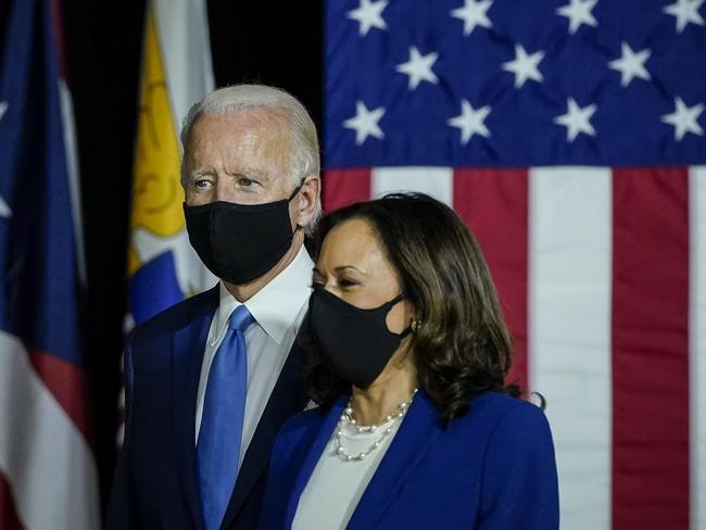 WILMINGTON, DE - AUGUST 12: Democratic presidential candidate former Vice President Joe Biden and his running mate Sen. Kamala Harris (D-CA) arrive to deliver remarks at the Alexis Dupont High School on August 12, 2020 in Wilmington, Delaware. Harris is the first Black woman and the first person of Indian descent to be nominated at the top of the presidential ticket by a major party in U.S. history.   Drew Angerer/Getty Images/AFP == FOR NEWSPAPERS, INTERNET, TELCOS & TELEVISION USE ONLY ==