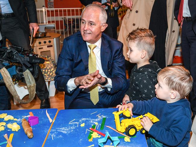 Mr Turnbull (centre) visited Mud Puddles Cottage childcare centre on Monday to announce the change, but parents have struck trouble with online adjustments.