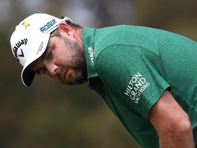 Marc Leishman of Australia reacts missing a putt on the final day of the World Cup of Golf at the Metropolitan Golf Club in Melbourne on November 25, 2018. (Photo by William WEST / AFP) / -- IMAGE RESTRICTED TO EDITORIAL USE - STRICTLY NO COMMERCIAL USE --