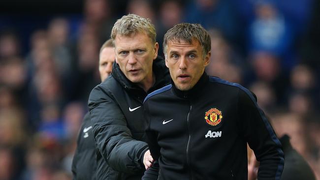 Phil Neville (R) while at Manchester United.